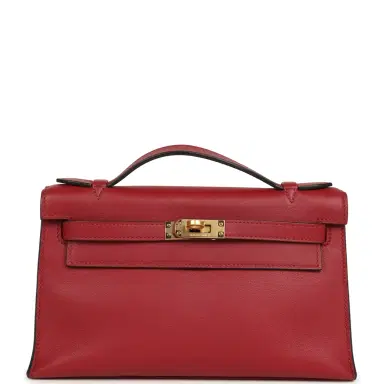 HERMÈS Pre-owned Hermes Kelly Pochette Rubis Swift Gold Hardware | Thumbnail 1 HERMÈS Pre-owned Hermes Kelly Pochette Rubis Swift Gold Hardware | Thumbnail 1
