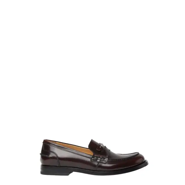 Varsity-inspired loafers featuring a strap with hand-sewn