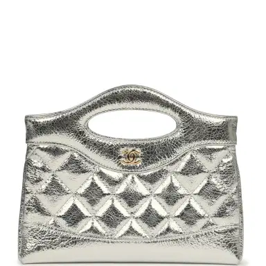 Chanel Chanel 31 Clutch with Chain Silver Metallic Calfskin Gold Hardware | Thumbnail 1 Chanel Chanel 31 Clutch with Chain Silver Metallic Calfskin Gold Hardware | Thumbnail 1