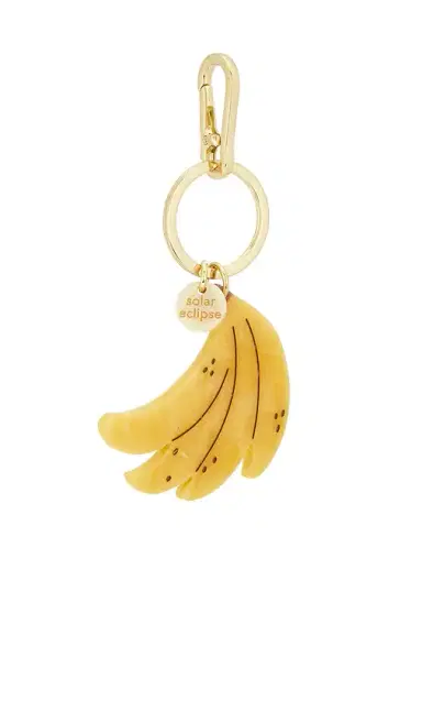 Solar Eclipse Hand-painted Banana Bag Charm + Keychain | Thumbnail 1 Solar Eclipse Hand-painted Banana Bag Charm + Keychain | Thumbnail 1