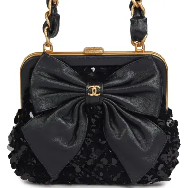 Chanel Pre-owned Chanel Mini Clutch with Bow Crossbody Bag Black Shiny Lambskin, Sequin Antique Gold Hardware | Thumbnail 1