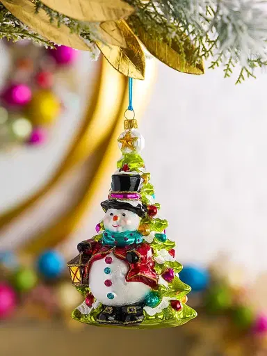 Glassware Art Studio Snowman With Lantern By The Tree Glass Ornament | Thumbnail 1 Glassware Art Studio Snowman With Lantern By The Tree Glass Ornament | Thumbnail 1