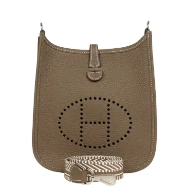 HERMÈS Hermes Evelyne TPM Etoupe Clemence Palladium Hardware | Thumbnail 1 HERMÈS Hermes Evelyne TPM Etoupe Clemence Palladium Hardware | Thumbnail 1