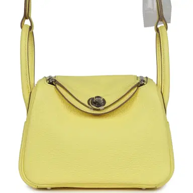 HERMÈS Hermes Mini Lindy Limoncello Clemence Palladium Hardware | Thumbnail 1 HERMÈS Hermes Mini Lindy Limoncello Clemence Palladium Hardware | Thumbnail 1