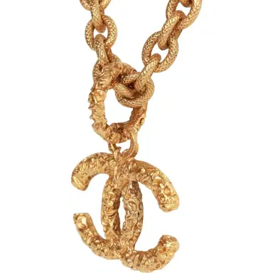 Chanel Vintage Chanel Gold Plated Lava CC Pendant Necklace | Thumbnail 4 Chanel Vintage Chanel Gold Plated Lava CC Pendant Necklace | Thumbnail 4