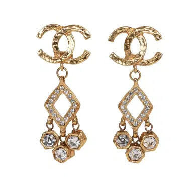Chanel Vintage Chanel Gold Plated Textured Rhinestone Dangle Clip On Earrings | Thumbnail 1 Chanel Vintage Chanel Gold Plated Textured Rhinestone Dangle Clip On Earrings | Thumbnail 1