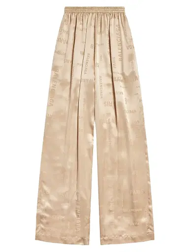 Balenciaga Women's Bal Paris Allover Fluid Tracksuit Pants - Light Beige | Thumbnail 1 Balenciaga Women's Bal Paris Allover Fluid Tracksuit Pants - Light Beige | Thumbnail 1