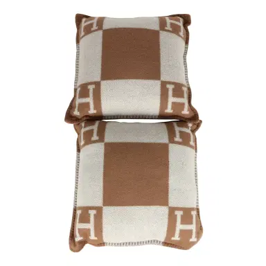 HERMÈS Hermes "Avalon" Signature H Cushion PM Ecru and Camel Set | Thumbnail 1 HERMÈS Hermes "Avalon" Signature H Cushion PM Ecru and Camel Set | Thumbnail 1