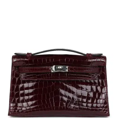 HERMÈS Hermes Kelly Pochette Bordeaux Shiny Niloticus Crocodile Palladium Hardware | Thumbnail 1 HERMÈS Hermes Kelly Pochette Bordeaux Shiny Niloticus Crocodile Palladium Hardware | Thumbnail 1
