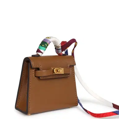 HERMÈS Hermes Mini Kelly Twilly Bag Charm Alezan Tadelakt Gold Hardware | Thumbnail 2 HERMÈS Hermes Mini Kelly Twilly Bag Charm Alezan Tadelakt Gold Hardware | Thumbnail 2