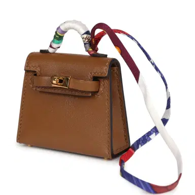 HERMÈS Hermes Mini Kelly Twilly Bag Charm Alezan Tadelakt Gold Hardware | Thumbnail 5 HERMÈS Hermes Mini Kelly Twilly Bag Charm Alezan Tadelakt Gold Hardware | Thumbnail 5