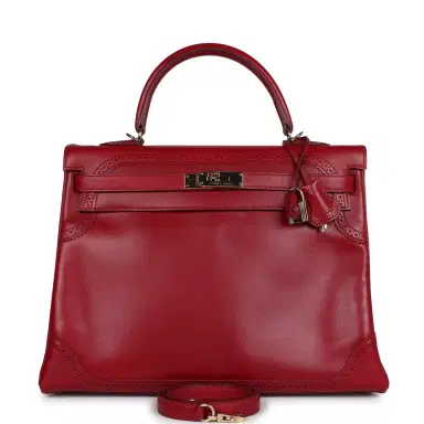 HERMÈS Pre-owned Hermes Ghillies Kelly Retourne 35 Rubis Tadelakt Permabrass Hardware | Thumbnail 1 HERMÈS Pre-owned Hermes Ghillies Kelly Retourne 35 Rubis Tadelakt Permabrass Hardware | Thumbnail 1