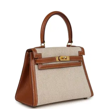 HERMÈS Vintage Hermes Kelly Sellier 20 Gold Courchevel and Ecru-Beige Toile H Canvas Gold Hardware | Thumbnail 1 HERMÈS Vintage Hermes Kelly Sellier 20 Gold Courchevel and Ecru-Beige Toile H Canvas Gold Hardware | Thumbnail 1