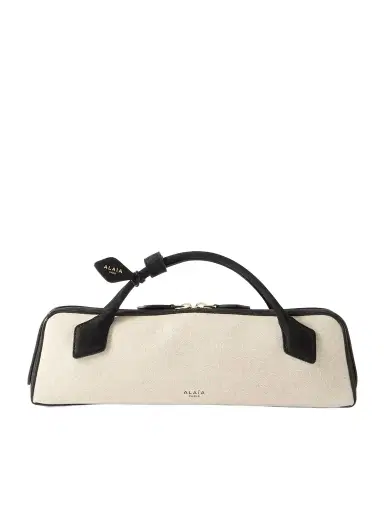 Alaïa Le Teckel Leather-trimmed Canvas Clutch | Thumbnail 1 Alaïa Le Teckel Leather-trimmed Canvas Clutch | Thumbnail 1