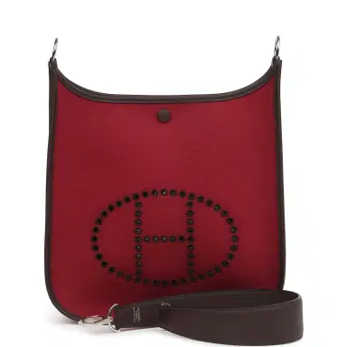 HERMÈS Hermes Neo Evelyne PM Rubis Officier Canvas and Rouge Sellier Swift Palladium Hardware | Thumbnail 1 HERMÈS Hermes Neo Evelyne PM Rubis Officier Canvas and Rouge Sellier Swift Palladium Hardware | Thumbnail 1