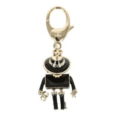 Chanel Chanel Gabrielle Doll Key Ring Black Resin & Faux Pearls Light Gold Tone Hardware | Thumbnail 2 Chanel Chanel Gabrielle Doll Key Ring Black Resin & Faux Pearls Light Gold Tone Hardware | Thumbnail 2