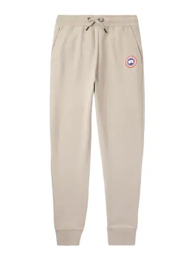 Canada Goose Huron Tapered Logo-Appliquéd Cotton-Jersey Sweatpants - Men | Thumbnail 1 Canada Goose Huron Tapered Logo-Appliquéd Cotton-Jersey Sweatpants - Men | Thumbnail 1