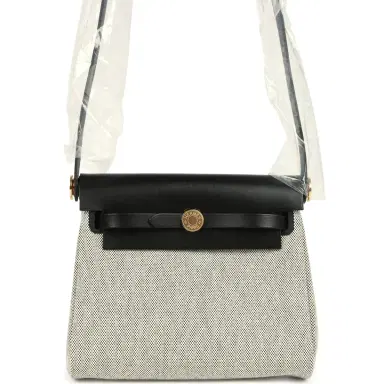 HERMÈS Hermes Herbag Zip 20 Mini Ecru and Black Toile H Canvas and Black Vache Hunter Gold Hardware | Thumbnail 1 HERMÈS Hermes Herbag Zip 20 Mini Ecru and Black Toile H Canvas and Black Vache Hunter Gold Hardware | Thumbnail 1