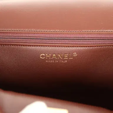 Chanel Chanel Large Shearling Flap Bag Dark Brown Lambskin and Beige Shearling Brushed Gold Hardware | Thumbnail 9 Chanel Chanel Large Shearling Flap Bag Dark Brown Lambskin and Beige Shearling Brushed Gold Hardware | Thumbnail 9