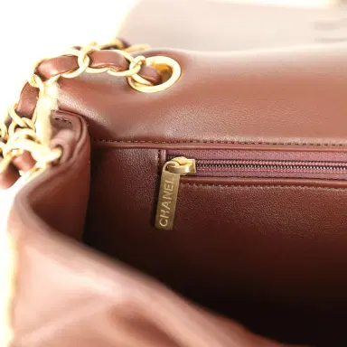 Chanel Chanel Large Shearling Flap Bag Dark Brown Lambskin and Beige Shearling Brushed Gold Hardware | Thumbnail 10 Chanel Chanel Large Shearling Flap Bag Dark Brown Lambskin and Beige Shearling Brushed Gold Hardware | Thumbnail 10