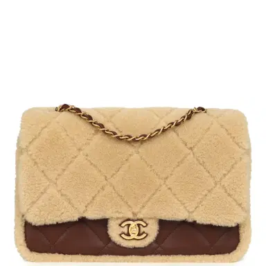 Chanel Chanel Large Shearling Flap Bag Dark Brown Lambskin and Beige Shearling Brushed Gold Hardware | Thumbnail 1 Chanel Chanel Large Shearling Flap Bag Dark Brown Lambskin and Beige Shearling Brushed Gold Hardware | Thumbnail 1