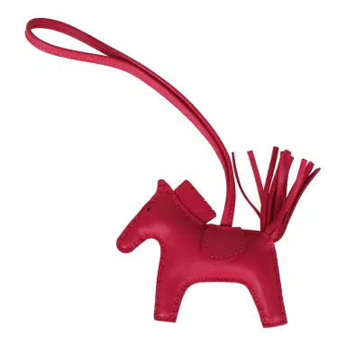 HERMÈS Hermes Rodeo Bag Charm PM Rose Mexico Milo Lambskin | Thumbnail 1 HERMÈS Hermes Rodeo Bag Charm PM Rose Mexico Milo Lambskin | Thumbnail 1