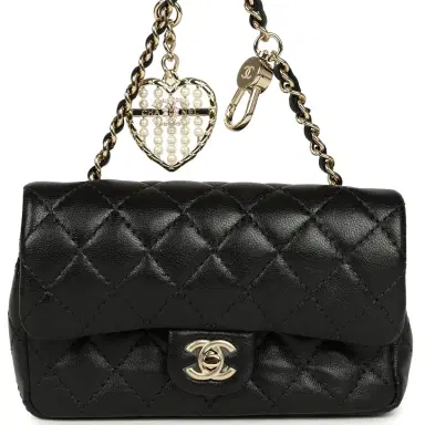 Chanel Chanel Nano Classic Double Flap Bag Charm Black Lambskin Light Gold Hardware | Thumbnail 1 Chanel Chanel Nano Classic Double Flap Bag Charm Black Lambskin Light Gold Hardware | Thumbnail 1