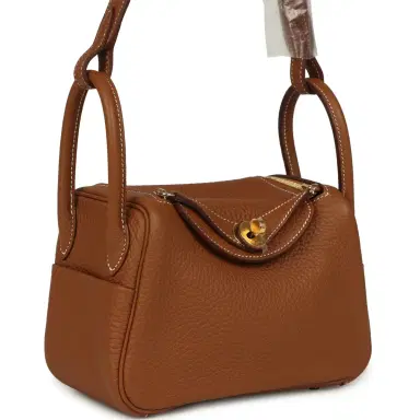 HERMÈS Hermes Mini Lindy Gold Clemence Gold Hardware | Thumbnail 2 HERMÈS Hermes Mini Lindy Gold Clemence Gold Hardware | Thumbnail 2