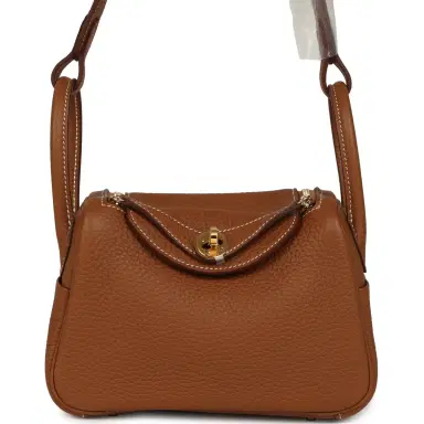 HERMÈS Hermes Mini Lindy Gold Clemence Gold Hardware | Thumbnail 1 HERMÈS Hermes Mini Lindy Gold Clemence Gold Hardware | Thumbnail 1