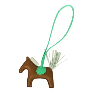 HERMÈS Hermes Rodeo Bag Charm PM Kraft, Vert Comics, Vert Fizz Milo Lambskin | Thumbnail 1 HERMÈS Hermes Rodeo Bag Charm PM Kraft, Vert Comics, Vert Fizz Milo Lambskin | Thumbnail 1