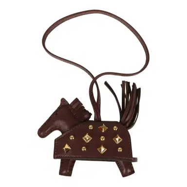 HERMÈS Hermes Rodeo Rock Bag Charm PM Terre Milo Lambskin Gold Hardware | Thumbnail 1 HERMÈS Hermes Rodeo Rock Bag Charm PM Terre Milo Lambskin Gold Hardware | Thumbnail 1