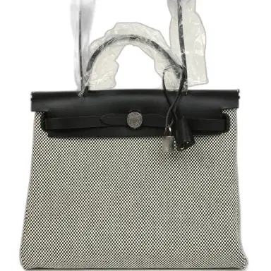 HERMÈS Hermes Herbag Zip PM 31 Black Vache Hunter and Ecru-Black Criss Viking Canvas Palladium Hardware | Thumbnail 1 HERMÈS Hermes Herbag Zip PM 31 Black Vache Hunter and Ecru-Black Criss Viking Canvas Palladium Hardware | Thumbnail 1