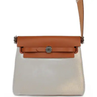 HERMÈS Hermes Herbag Zip 20 Mini Ecru and Beige Toile H Canvas and Fauve Vache Hunter Gold Hardware | Thumbnail 1 HERMÈS Hermes Herbag Zip 20 Mini Ecru and Beige Toile H Canvas and Fauve Vache Hunter Gold Hardware | Thumbnail 1