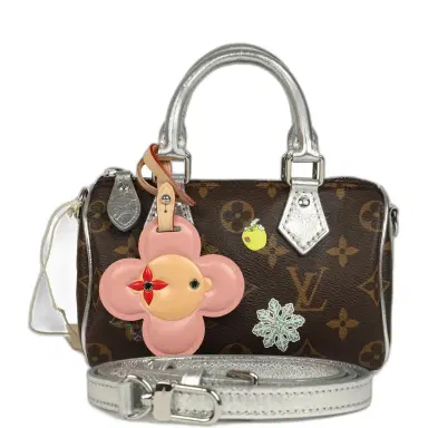 Louis Vuitton Louis Vuitton "57th Street NYC" Vivienne Nano Speedy Bag Brown Monogram Snowy Pearl Gold Hardware | Thumbnail 1 Louis Vuitton Louis Vuitton "57th Street NYC" Vivienne Nano Speedy Bag Brown Monogram Snowy Pearl Gold Hardware | Thumbnail 1