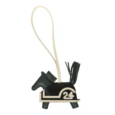 HERMÈS Hermes Rodeo Robeo 24 Charm PM Vert Mangrove, Craie, Black Milo Lambskin | Thumbnail 1 HERMÈS Hermes Rodeo Robeo 24 Charm PM Vert Mangrove, Craie, Black Milo Lambskin | Thumbnail 1