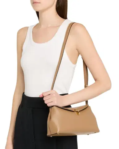 Toteme T-Lock Clutch in Palmellata Leather | Thumbnail 1 Toteme T-Lock Clutch in Palmellata Leather | Thumbnail 1