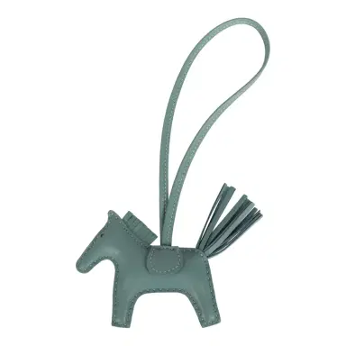 HERMÈS Hermes Rodeo Bag Charm PM Ciel Milo Lambskin | Thumbnail 1 HERMÈS Hermes Rodeo Bag Charm PM Ciel Milo Lambskin | Thumbnail 1