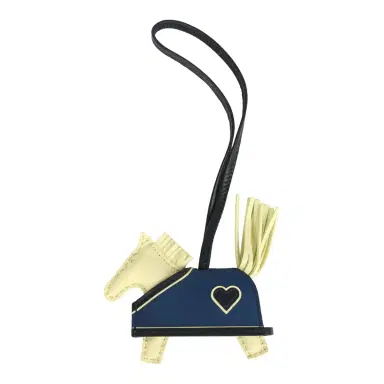 HERMÈS Hermes Rodeo Robeo Coeur Charm PM Jaune Milton, Bleu Nuit and Bleu Tie Milo Lambskin | Thumbnail 1 HERMÈS Hermes Rodeo Robeo Coeur Charm PM Jaune Milton, Bleu Nuit and Bleu Tie Milo Lambskin | Thumbnail 1