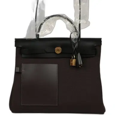 HERMÈS Hermes Herbag Zip Pocket PM 31 Ebene Militaire Canvas and Black Vache Hunter Gold Hardware | Thumbnail 1 HERMÈS Hermes Herbag Zip Pocket PM 31 Ebene Militaire Canvas and Black Vache Hunter Gold Hardware | Thumbnail 1