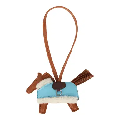 HERMÈS Hermes Rodeo Robeo Plush Charm PM Gold, Celeste, Capucine Milo Lambskin and Ecru Merino Wool Palladium Hardware | Thumbnail 1 HERMÈS Hermes Rodeo Robeo Plush Charm PM Gold, Celeste, Capucine Milo Lambskin and Ecru Merino Wool Palladium Hardware | Thumbnail 1