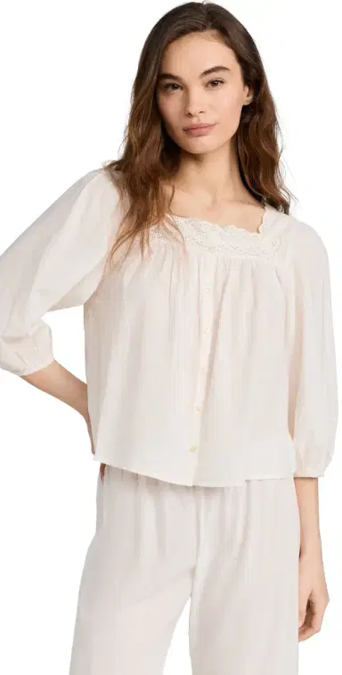 The Great. THE GREAT. The Eyelet Button Sleep Top True White 2 | Thumbnail 1 The Great. THE GREAT. The Eyelet Button Sleep Top True White 2 | Thumbnail 1