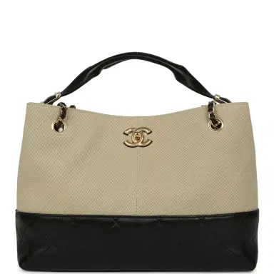 Chanel Chanel Small Coco Base Hobo Bag Beige Canvas and Black Shiny Lambskin Gold Hardware | Thumbnail 1 Chanel Chanel Small Coco Base Hobo Bag Beige Canvas and Black Shiny Lambskin Gold Hardware | Thumbnail 1