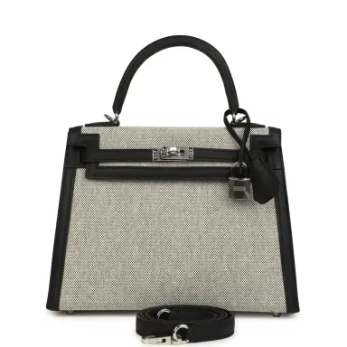 HERMÈS Hermes Kelly Sellier 25 Ecru & Black Toile H Canvas and Black Swift Palladium Hardware | Thumbnail 1 HERMÈS Hermes Kelly Sellier 25 Ecru & Black Toile H Canvas and Black Swift Palladium Hardware | Thumbnail 1