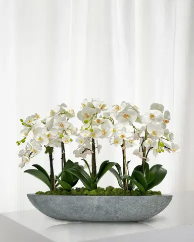 Winward Home Orchid 30" Faux Floral Arrangement in Fiberglass Boat | Thumbnail 1 Winward Home Orchid 30" Faux Floral Arrangement in Fiberglass Boat | Thumbnail 1