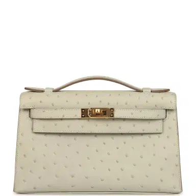 HERMÈS Hermes Kelly Pochette Gris Perle Ostrich Gold Hardware | Thumbnail 1 HERMÈS Hermes Kelly Pochette Gris Perle Ostrich Gold Hardware | Thumbnail 1