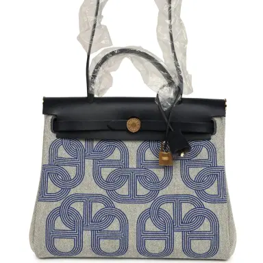 HERMÈS Hermes Herbag Zip PM 31 "Circuit 24" Bleu Royal, Ecru Toile H Canvas and Bleu Indigo Vache Hunter Leather Gold Hardware | Thumbnail 1 HERMÈS Hermes Herbag Zip PM 31 "Circuit 24" Bleu Royal, Ecru Toile H Canvas and Bleu Indigo Vache Hunter Leather Gold Hardware | Thumbnail 1