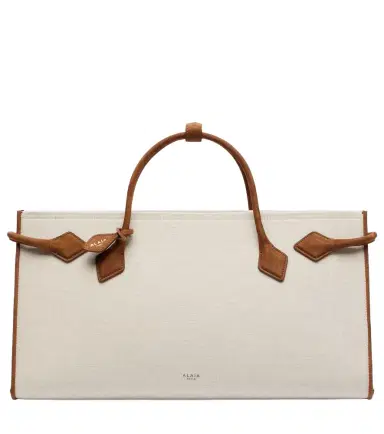 Alaïa Alaïa Le Teckel leather-trimmed canvas tote bag | Thumbnail 1 Alaïa Alaïa Le Teckel leather-trimmed canvas tote bag | Thumbnail 1