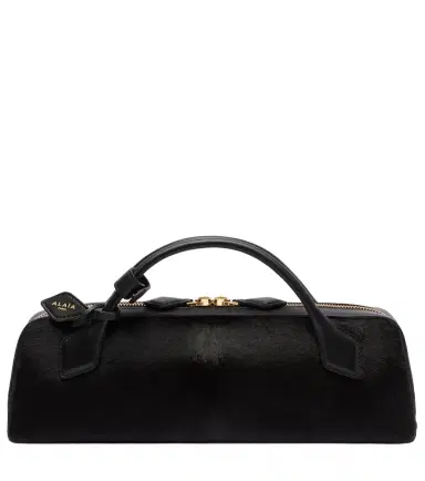 Alaïa Alaïa Le Teckel Small calf hair clutch | Thumbnail 1 Alaïa Alaïa Le Teckel Small calf hair clutch | Thumbnail 1