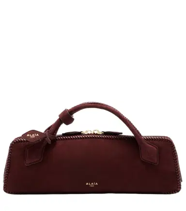 Alaïa Alaïa Le Teckel Small suede clutch | Thumbnail 1 Alaïa Alaïa Le Teckel Small suede clutch | Thumbnail 1