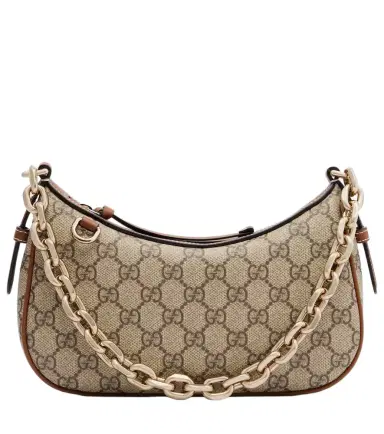 Gucci GG Emblem Small canvas shoulder bag | Thumbnail 1 Gucci GG Emblem Small canvas shoulder bag | Thumbnail 1